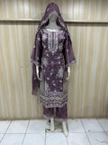 Purple embroidered traditional outfit on a mannequin against a striped