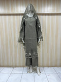 brown embroidered outfit with maroon details on a mannequin against a striped