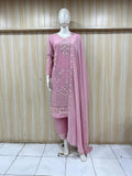 Mannequin wearing a pink traditional outfit with a matching dupatta against a striped