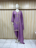 Purple embroidered outfit on a mannequin against a striped