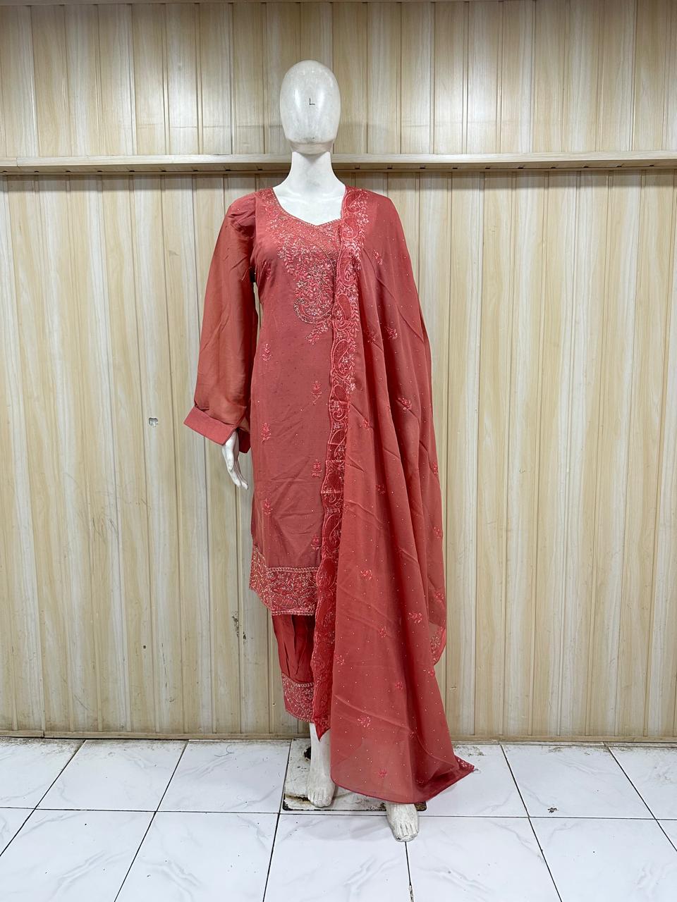 Red traditional outfit with lace details on a mannequin against a striped