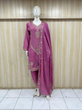 Purple traditional outfit with embroidery on a mannequin against a striped