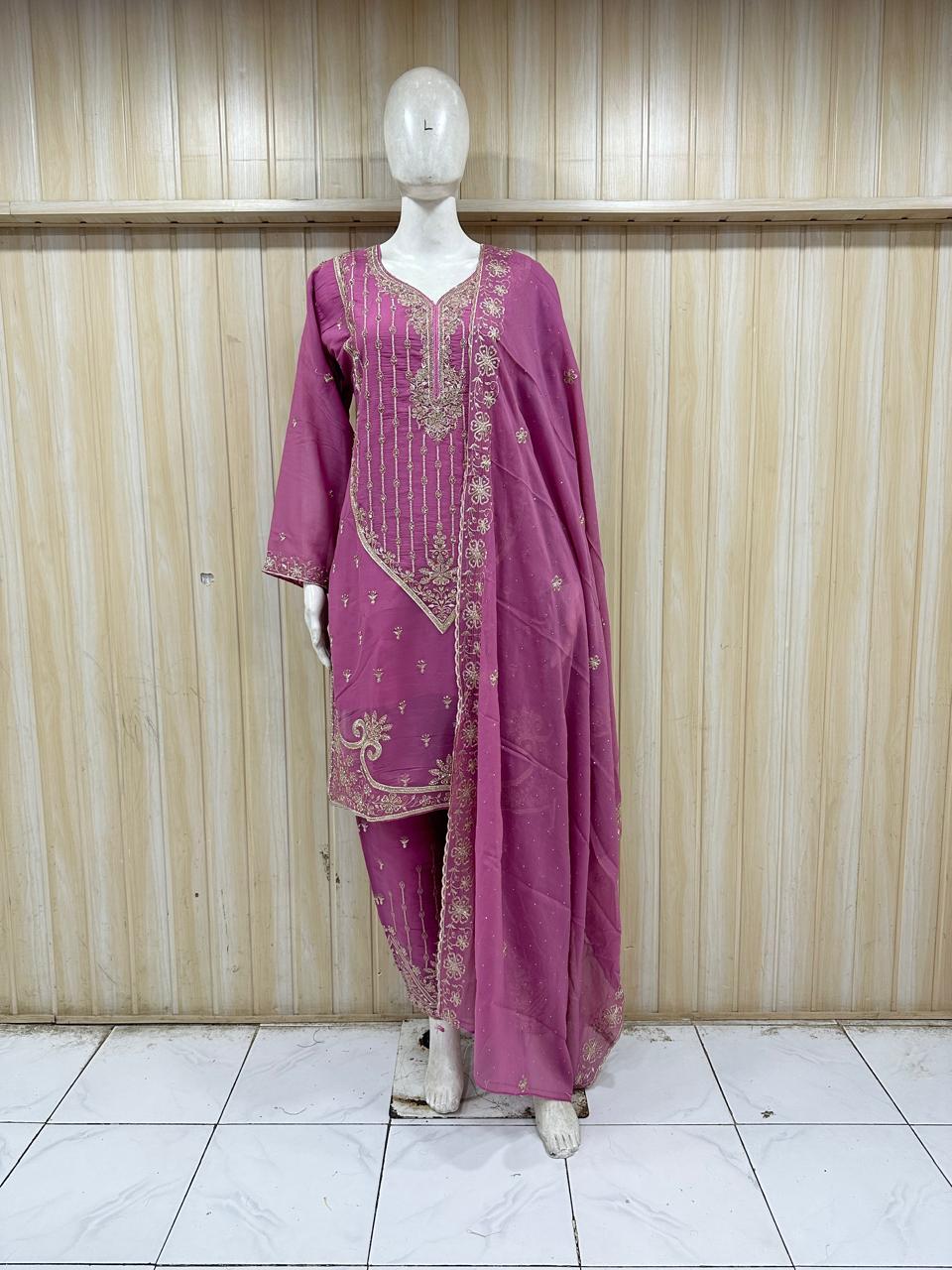 Purple traditional outfit with embroidery on a mannequin against a striped