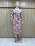 Mannequin wearing a white and pink colored outfit against a striped