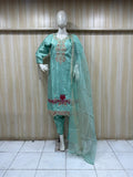 Mannequin wearing a light blue embroidered outfit with a sheer dupatta against a striped