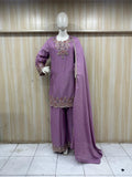 Purple embroidered outfit with dupatta on a mannequin against a striped