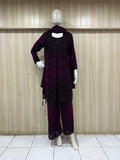 purple and black traditional outfit with white embroidery on a mannequin against a striped