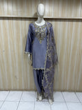 Mannequin wearing a purple fharshi outfit against a striped