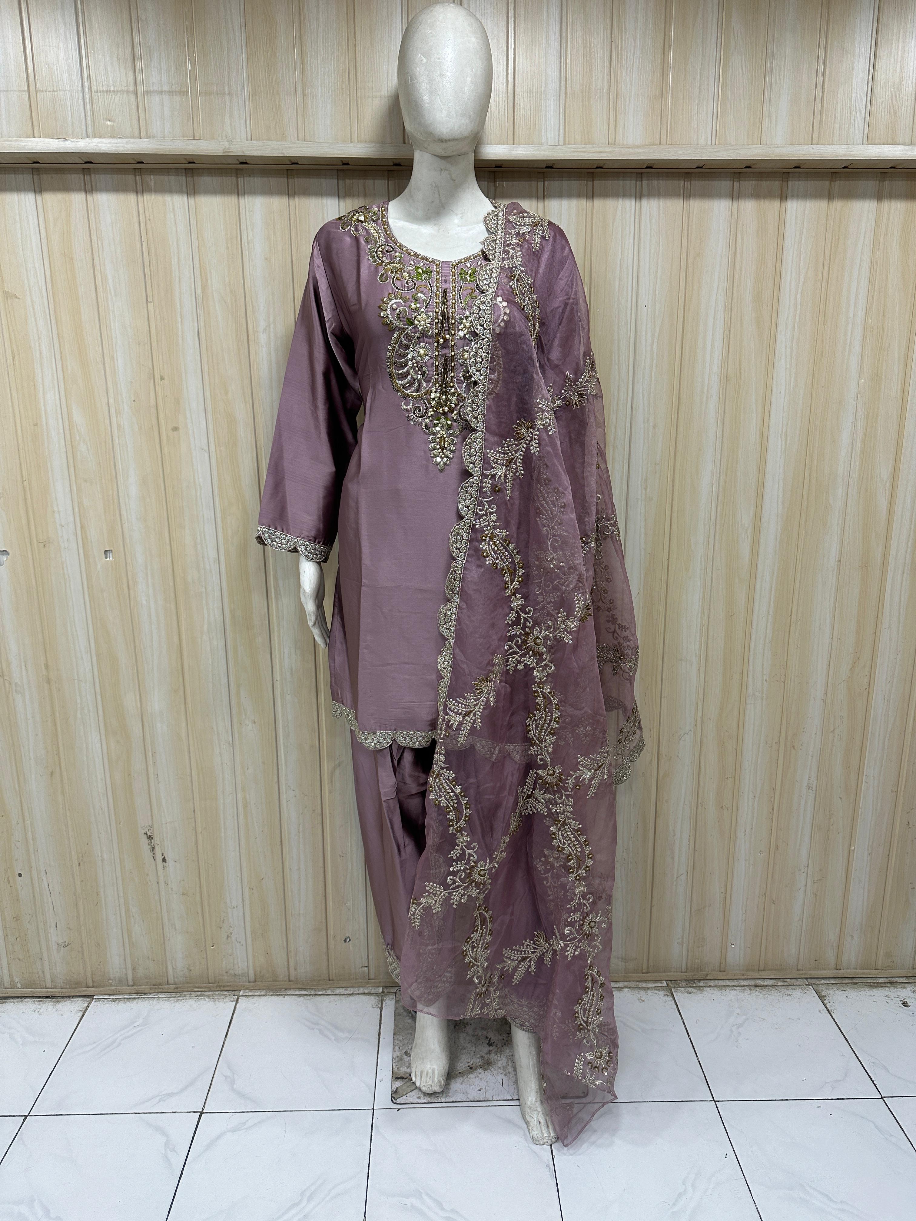 Mannequin wearing a purple farshi outfit against a striped  ChatGPT2:09 PM
