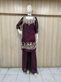 dark Purple embroidered outfit on a mannequin against a striped
