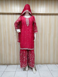 “Elegant pink embroidered outfit on mannequin against striped background – perfect for a soft, graceful & classy ethnic look