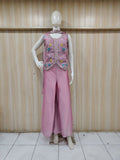 purple embroidered outfit on mannequin against striped
