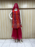dark pink embroidered outfit on mannequin against striped