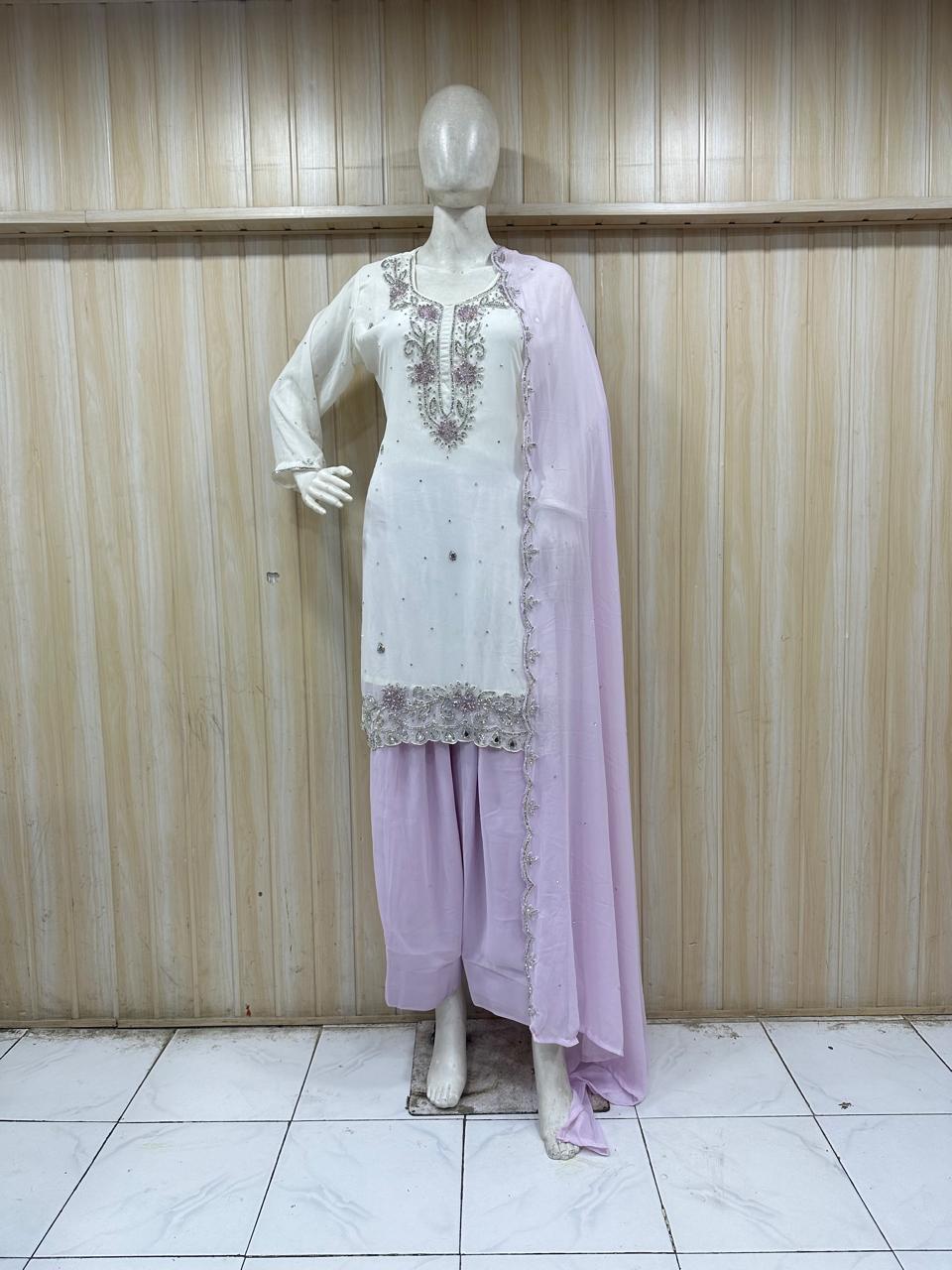 Mannequin wearing a white embroidered top with a light purple dupatta against a striped