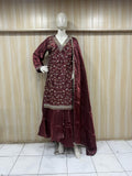 Mannequin wearing a maroon embroidered top with a dupatta against a striped