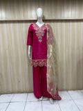dark pink traditional outfit with matching dupatta on a mannequin against a striped
