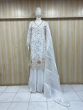 white traditional outfit with matching dupatta on a mannequin against a striped