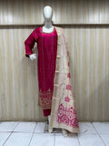 dark pink traditional outfit with matching dupatta on a mannequin against a striped