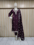 purple white gold traditional outfit with matching dupatta on a mannequin against a striped