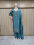 blue gold traditional outfit with matching dupatta on a mannequin against a striped