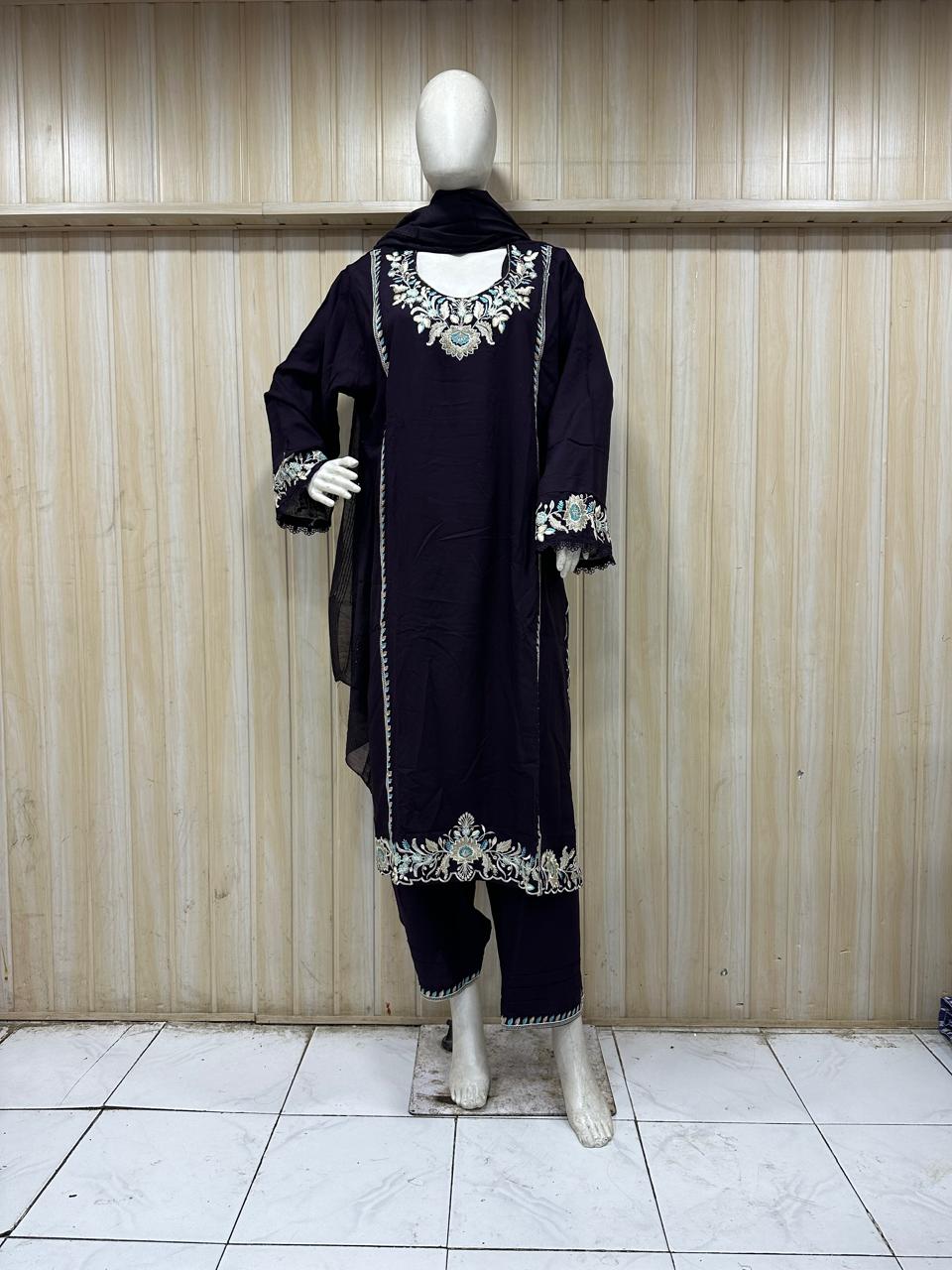 DARK PURPLE gold traditional outfit with matching dupatta on a mannequin against a striped