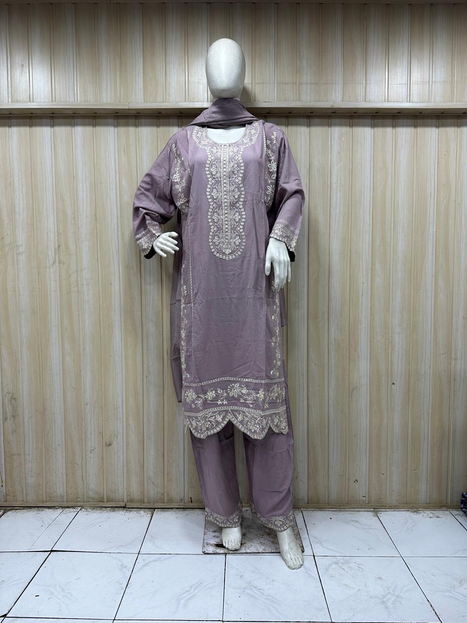 purple white gold traditional outfit with matching dupatta on a mannequin against a striped