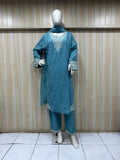 blue gold traditional outfit with matching dupatta on a mannequin against a striped