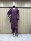 dark purple gold traditional outfit with matching dupatta on a mannequin against a striped