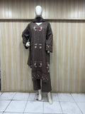 dark brown gold traditional outfit with matching dupatta on a mannequin against a striped