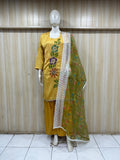 Mannequin wearing a yellow embroidered outfit with a green dupatta against a striped