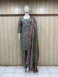 Mannequin wearing a grey floral dress with a matching dupatta against a striped
