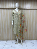 beige traditional outfit with floral patterns on a mannequin against a striped