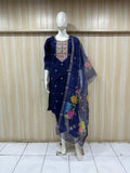 Navy blue embroidered outfit with a floral dupatta on a mannequin against a striped