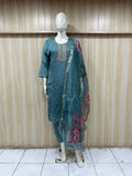 blue gold embroidered outfit with a floral dupatta on a mannequin against a striped