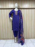 navy blue embroidered outfit on a mannequin against a striped