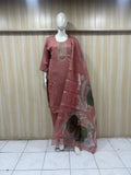 rose gold Purple traditional outfit with a dupatta on a mannequin against a striped
