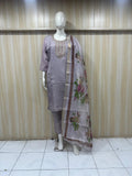 grey gold  traditional outfit with a dupatta on a mannequin against a striped