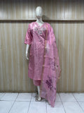 Mannequin wearing a pink traditional outfit with a floral dupatta against a striped