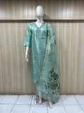 Mannequin wearing a gometry traditional outfit with a floral dupatta against a striped