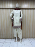 Mannequin wearing a white floral dress against a striped