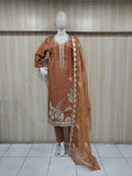 oranj embroidered dress with a matching dupatta on a mannequin against a striped