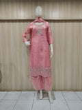 pink embroidered dress with a matching dupatta on a mannequin against a striped